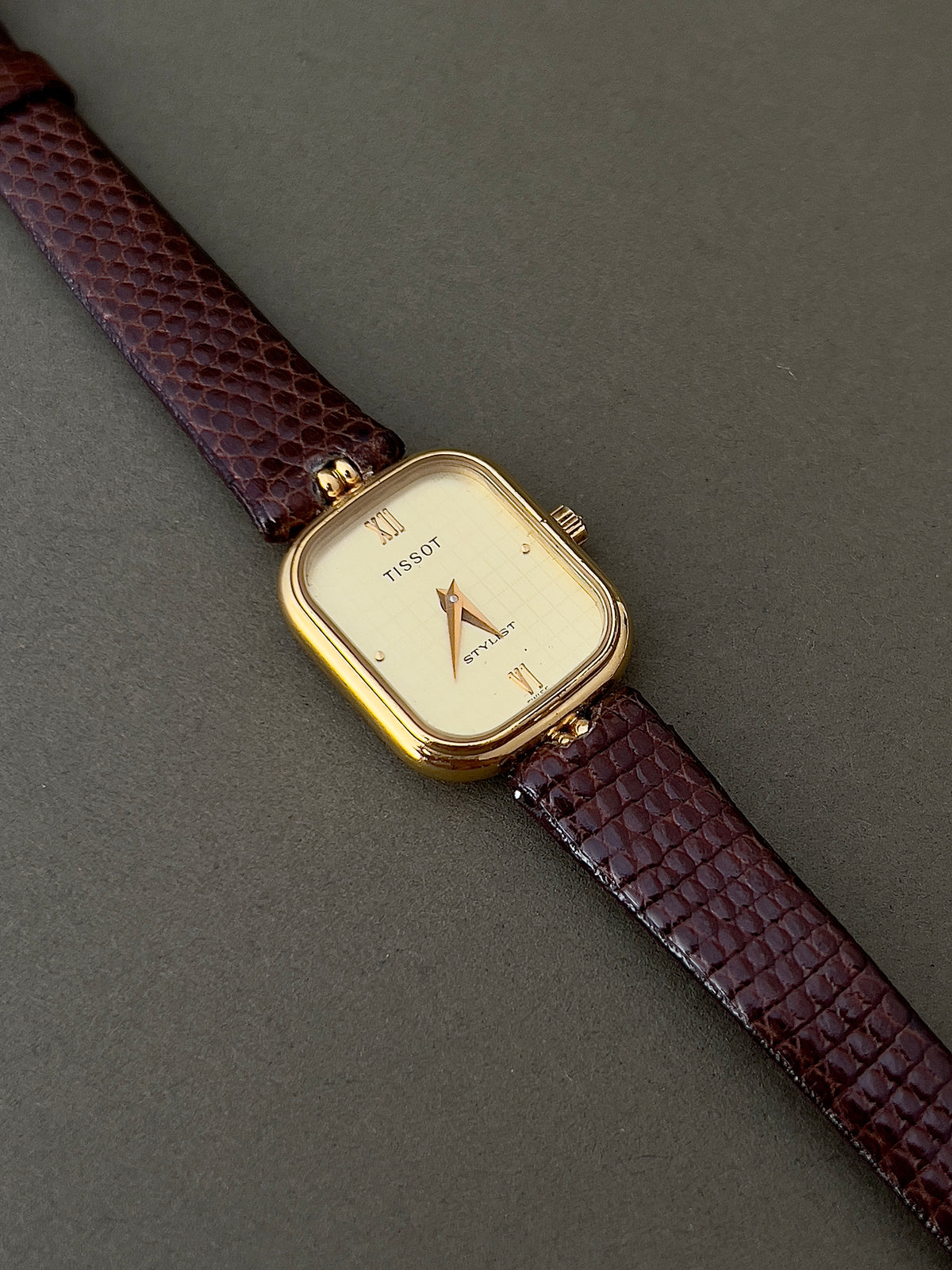 Tissot Stylist Gold Cushion Women’s Watch with Patterned Dial — close view of patterned dial.