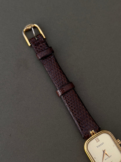 Tissot Stylist Gold Cushion Women’s Watch with Patterned Dial — close view of dial, strap and buckle.