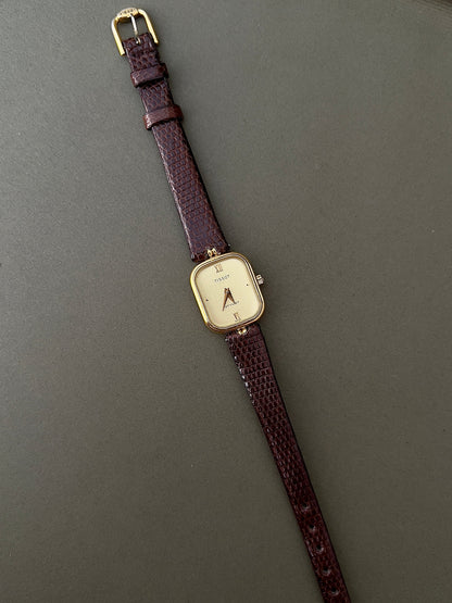 Tissot Stylist Gold Cushion Women’s Watch with Patterned Dial — full watch and brown strap.