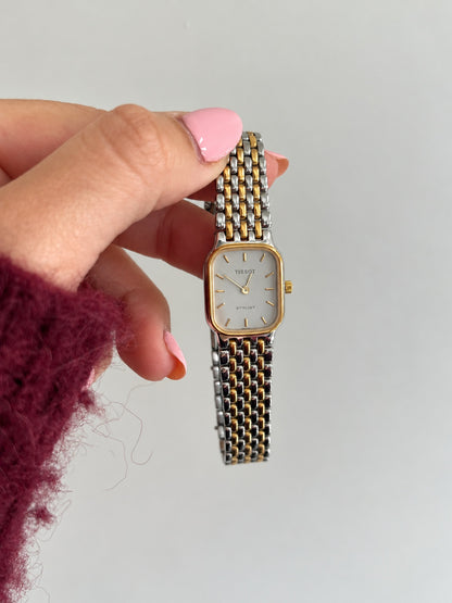Tissot Stylist women’s watch showing its slim rectangular case and closely spaced polished bracelet links.