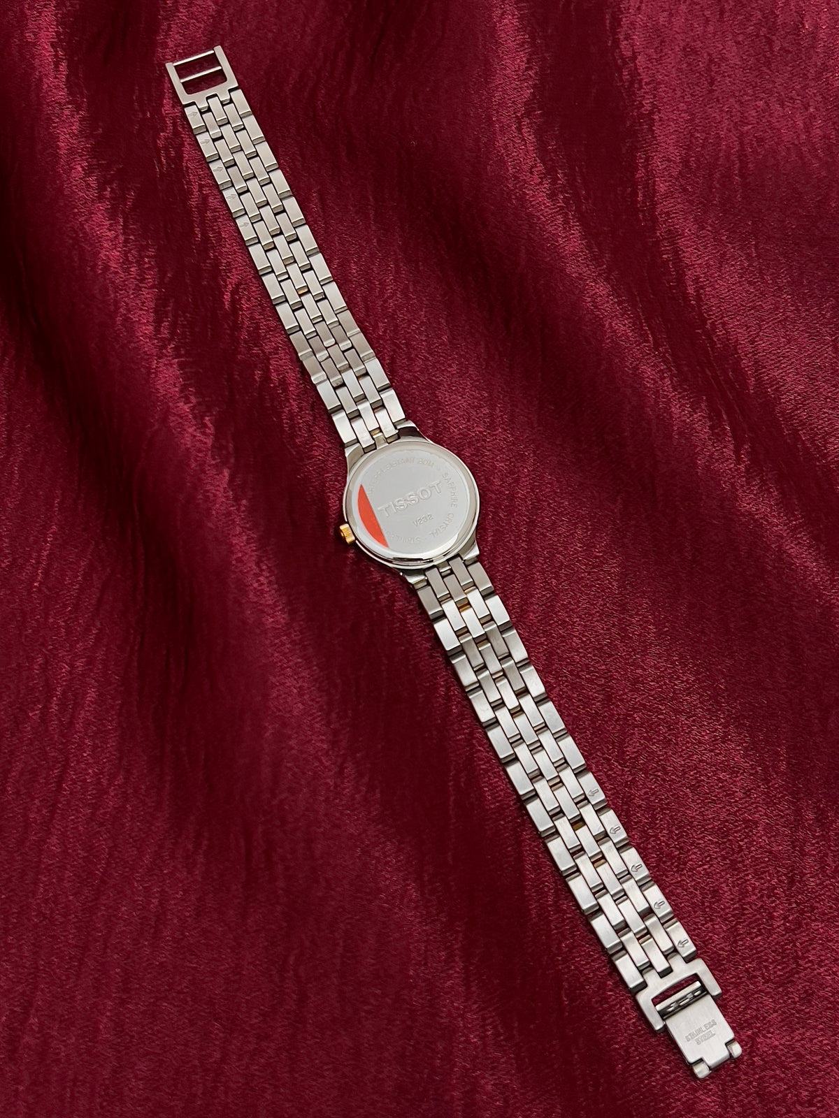 Tissot Gold Sunburst Dial Two Tone Women’s Watch, bracelet underside and caseback.
