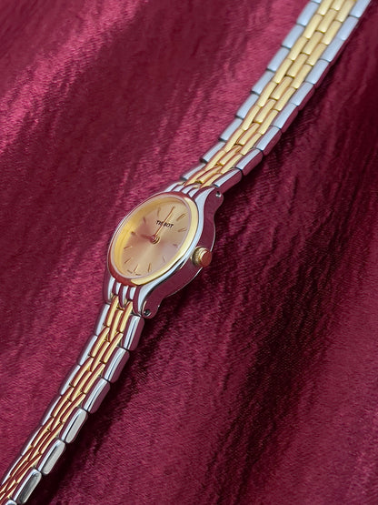 Tissot Gold Sunburst Dial Two Tone Women’s Watch, case profile.