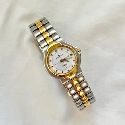 Universal Genève Polerouter women’s two tone Swiss watch with integrated bracelet, white dial, gold tone bezel and elegant luxury sport design.