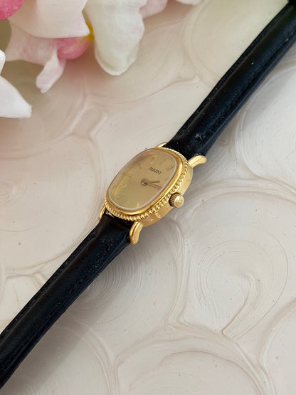 Rado Gold Cushion Women’s Watch with Fluted Case — case profile and fluted edge.