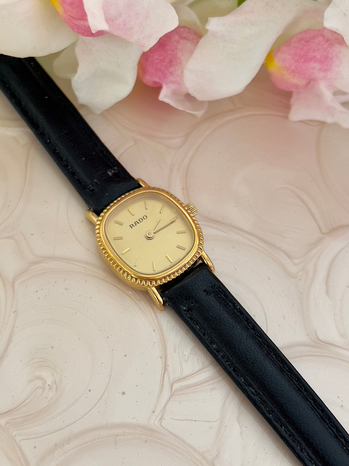 Rado Gold Cushion Women’s Watch with Fluted Case — close view of fluted cushion case.