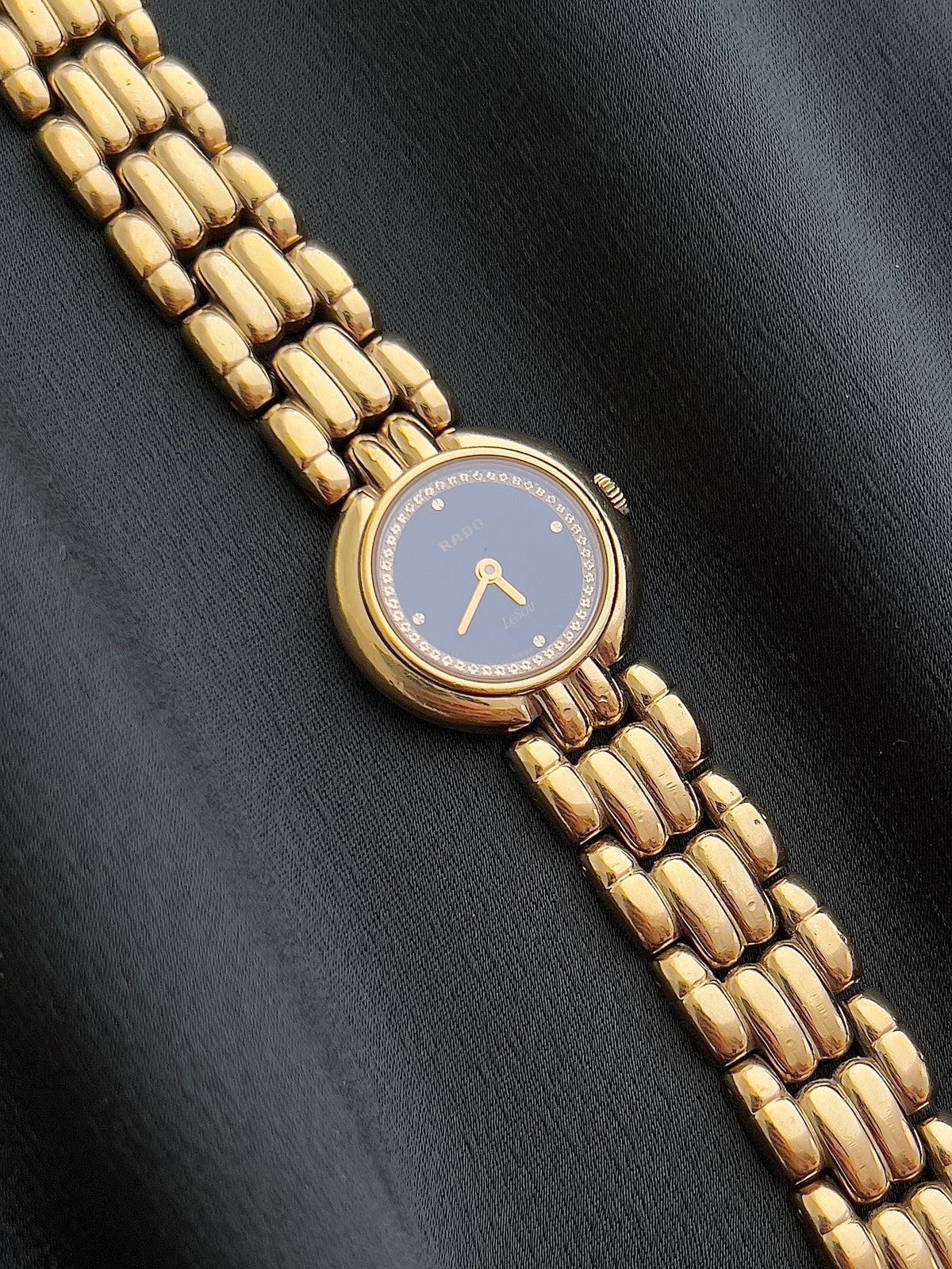 Rado Le Soir Black Gold watch — decorative gold hour markers