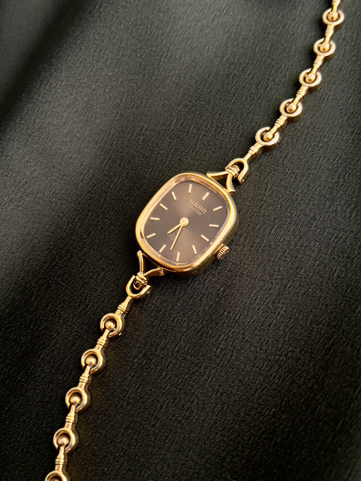Rado Bronze Dial Curlicue Bracelet watch — angled case view
