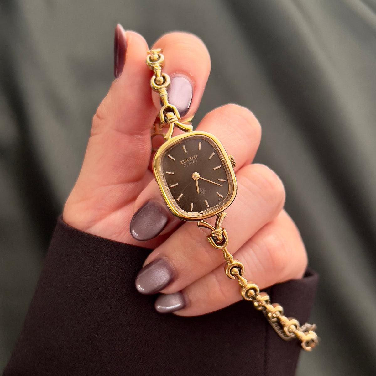 Rado Bronze Dial Curlicue Bracelet watch — held front view