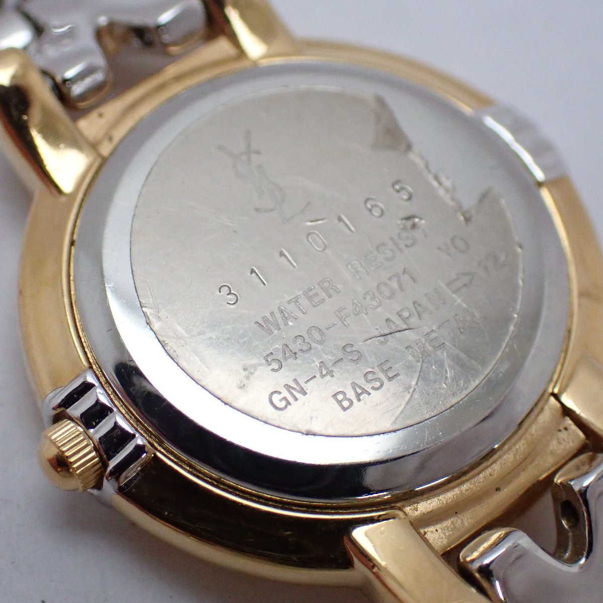 Caseback of the Yves Saint Laurent 5430-F43071 showing the serial, water-resistant marking and stainless-steel back