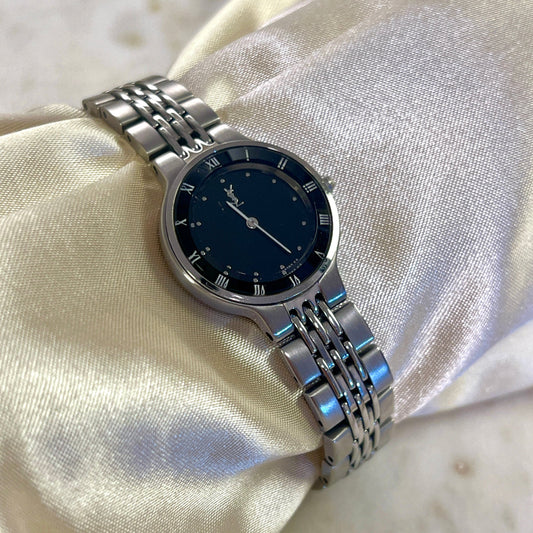 Yves Saint Laurent Black Dial Ladies Watch with Domed Glass, caseback detail of a vintage women's watch at Gilded Hour.