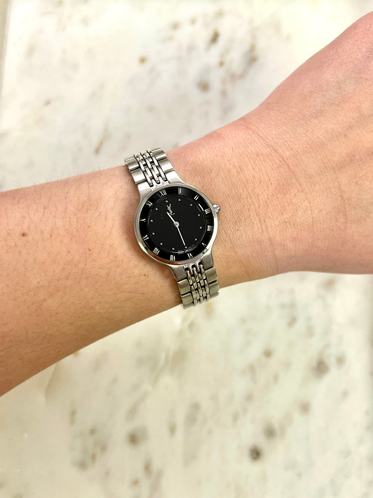 Yves Saint Laurent Black Dial Silver Bracelet Women’s Watch; silver tone bracelet with multiple rows of links. Product photograph 2 of 8.