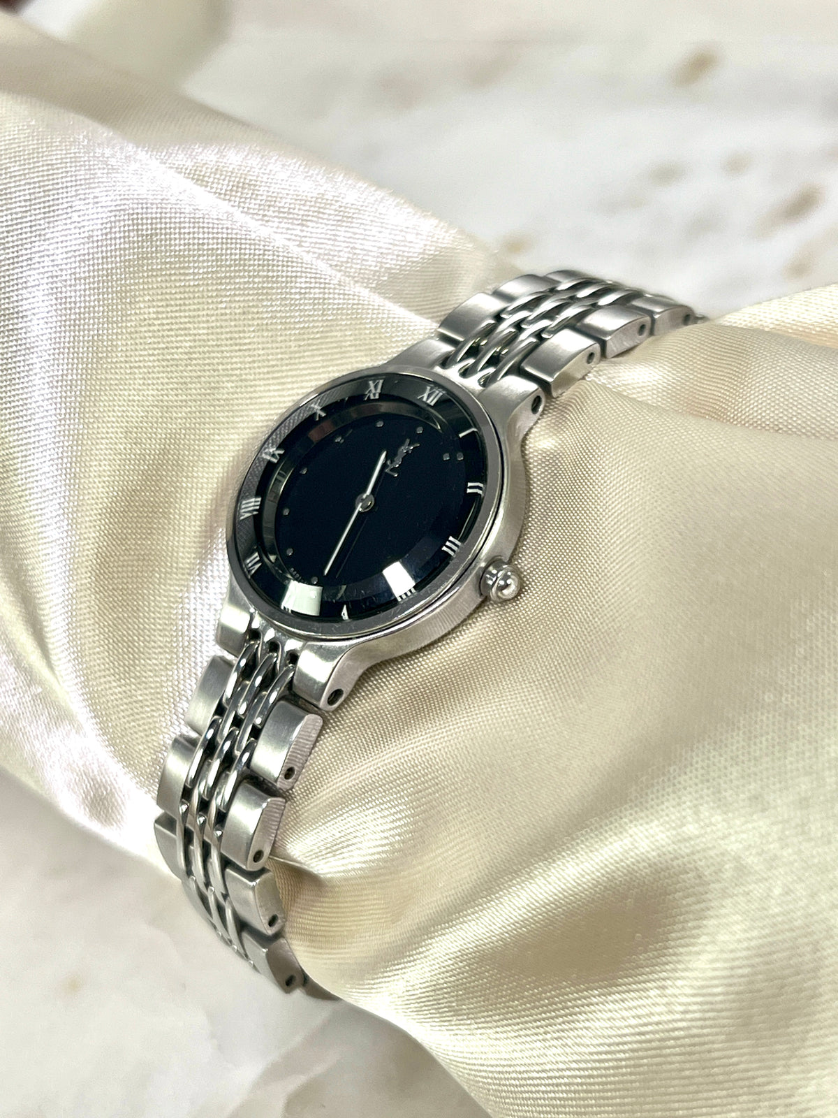 Yves Saint Laurent Black Dial Silver Bracelet Women’s Watch; silver tone bracelet with multiple rows of links. Product photograph 6 of 8.