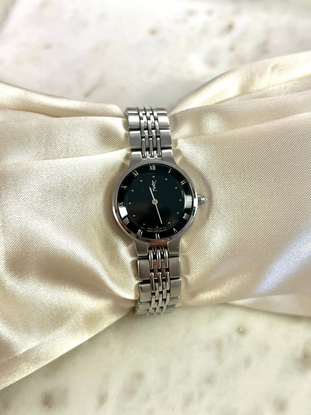 Yves Saint Laurent Black Dial Silver Bracelet Women’s Watch; silver tone bracelet with multiple rows of links. Product photograph 7 of 8.