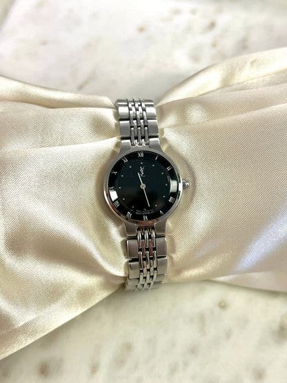 Yves Saint Laurent Black Dial Silver Bracelet Women’s Watch; silver tone bracelet with multiple rows of links. Product photograph 7 of 8.