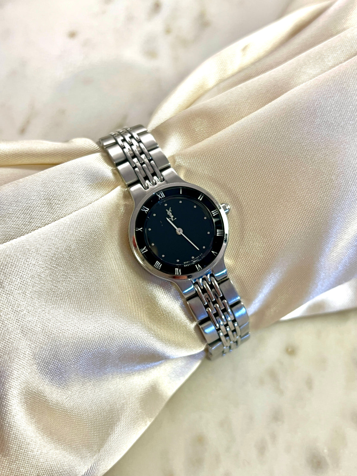 Yves Saint Laurent Black Dial Silver Bracelet Women’s Watch; silver tone bracelet with multiple rows of links. Product photograph 8 of 8.