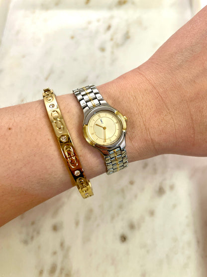 Yves Saint Laurent Gold Sunburst Dial Two Tone Women’s Watch; integrated two tone bracelet with gold tone centre details. Product photograph 2 of 10.